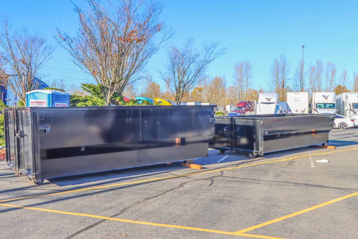 Professional dumpster rental service with roll-off container on residential driveway in Colleyville